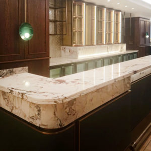 The Rib Room - TCJH - Breccia Capraia marble bar tops