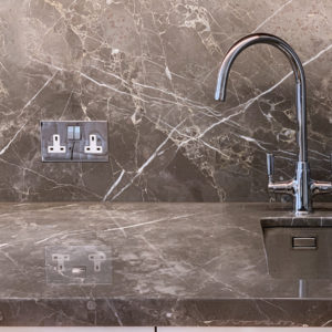 Polished Fior di Bosco marble kitchen worktop with mitred edge