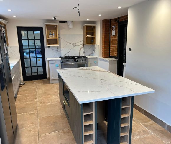 Carrara Ice Age Quartz worktops, island and s full height splashbacks