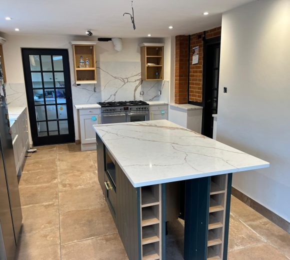 Carrara Ice Age Quartz worktops, island and s full height splashbacks