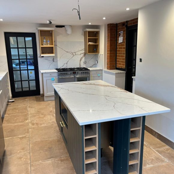 Carrara Ice Age Quartz worktops, island and s full height splashbacks